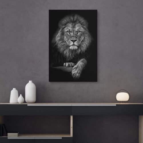 Majestic Monarch - Animal Prints - Black and White Portrait of the Lion on Canvas Art Prints. The monochrome composition adds a timeless and dramatic quality to the image, accentuating the lion's fierce expression, intricate mane, and the depth of its penetrating gaze. The contrasting tones create a striking visual impact, evoking a sense of reverence for the ruler of the animal kingdom.