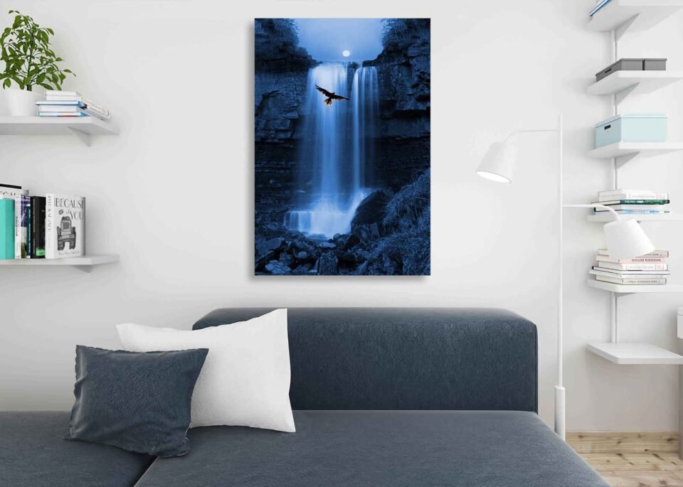 Majestic Serenity Wall Decor - Bird of Prey Soaring by Moonlit Waterfall In this scene, a magnificent bird of prey gracefully hovers against the backdrop of a mesmerizing waterfall, illuminated by the enchanting glow of the moon. The silhouetted details create an aura of mystery and allure, inviting you to explore the wonders of the wilderness.