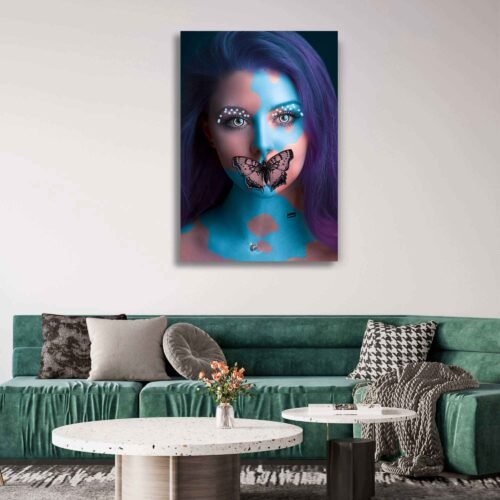 Metamorphosis of Beauty - Woman with Butterfly Lips - Art Portrait. In this stunning artwork, a woman is portrayed with her body adorned in mesmerizing blue body paint. The artistic use of color adds an ethereal quality, evoking a sense of otherworldly beauty and mystery. However, it is the captivating focal point that truly captures the imagination - a delicate butterfly gracefully perched on her lips.