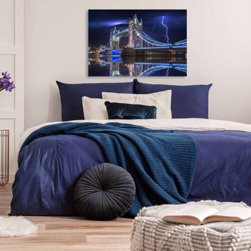 Thunderstruck Majesty - London's Tower Bridge in the Storm - Cityscape Wall Art. This captivating artwork captures the timeless beauty of the landmark bridge amidst a dramatic stormy night, complete with crackling thunder and brilliant lightning bolts illuminating the sky. This Canvas Print is the perfect addition to your decor, invoking a sense of wonder and admiration for the beauty of nature and human ingenuity.