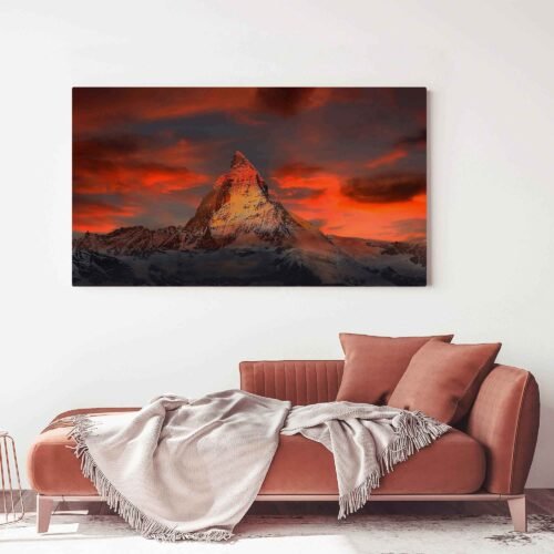 Alpine Serenity - Canvas Art This canvas print captures the essence of the Swiss Alps with a stunning view of the majestic Matterhorn at sunset. The interplay of vibrant hues in the sky, from the warm tones of dusk to the snowy peaks, creates a mesmerizing scene that brings the magic of nature into your space